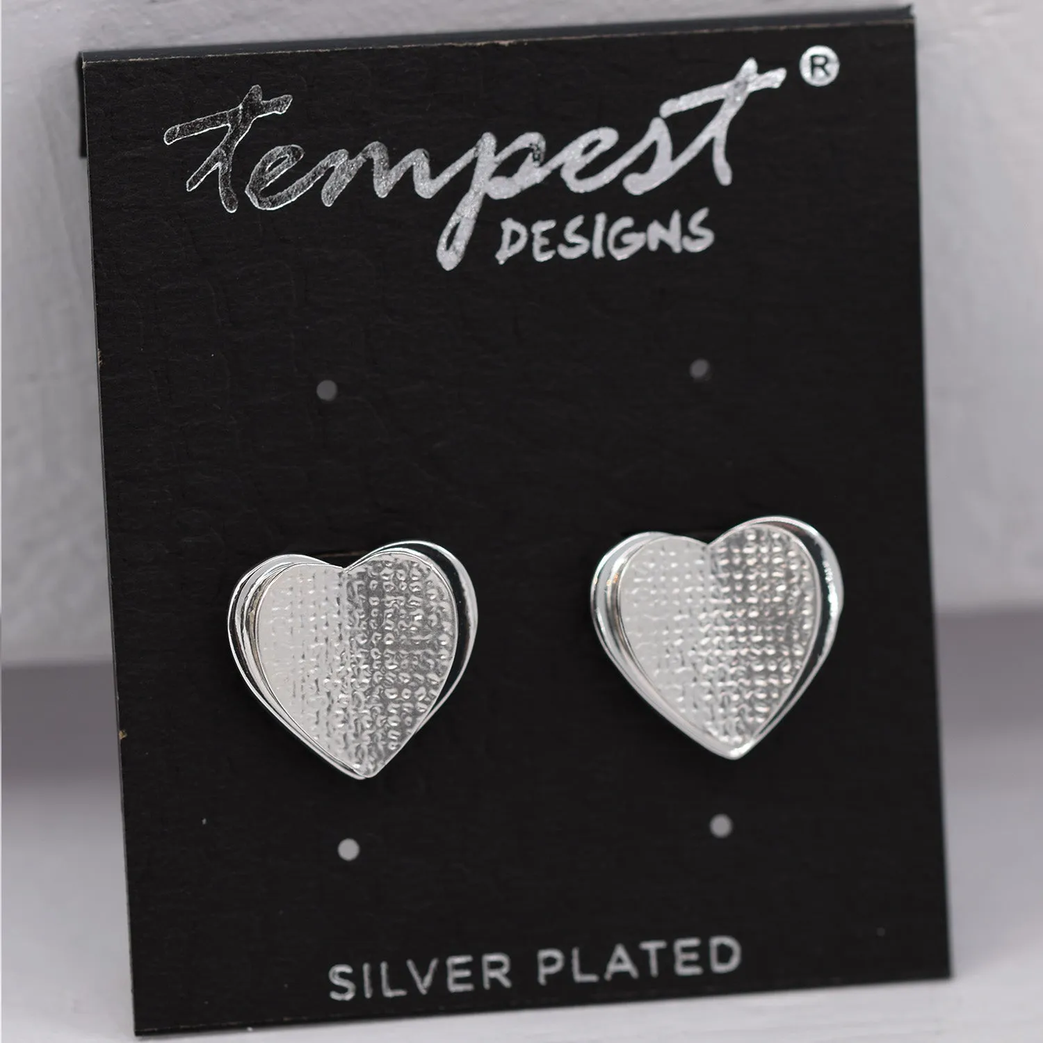 Delicate curved heart stud earrings