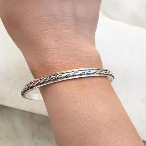 Knotted Silver Spinner Bangle
