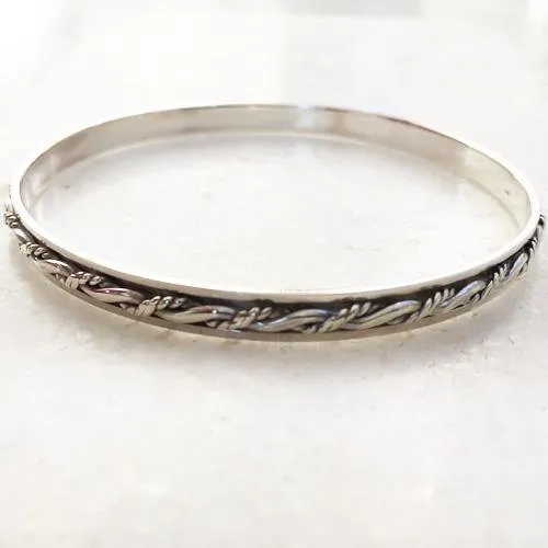 Knotted Silver Spinner Bangle